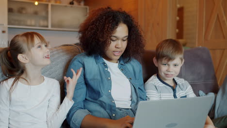 family learning together on a laptop