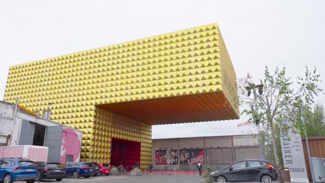 modern gold building in urban setting