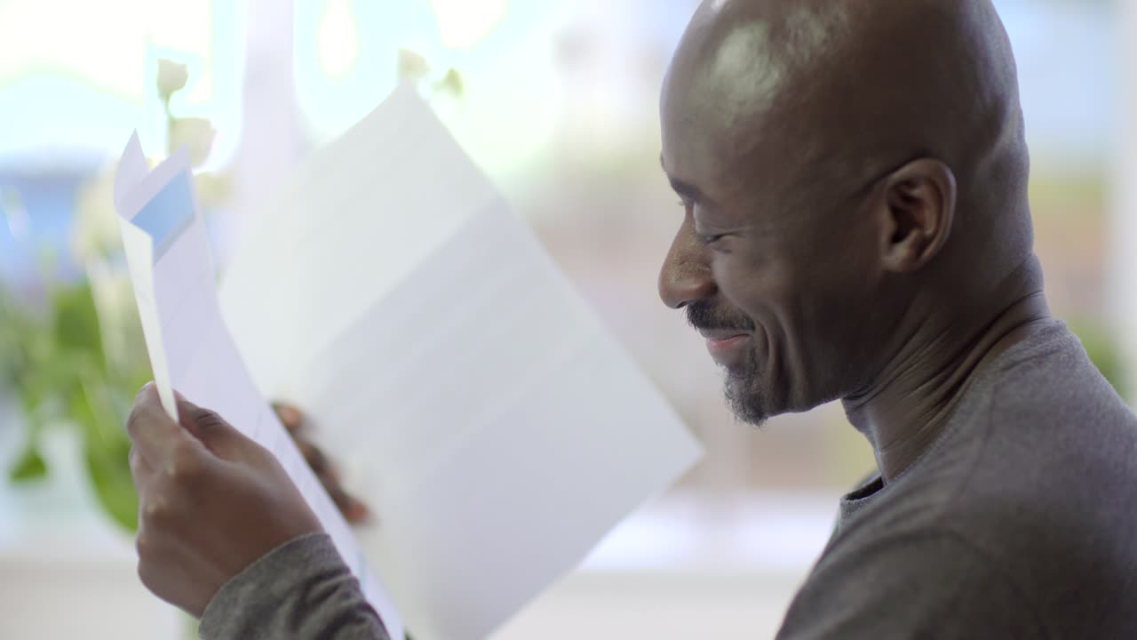 Close Up of Man Reading Mail