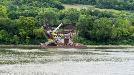 heavy equipment on construction site at the banks of ohio river in cincinnati, ohio, usa