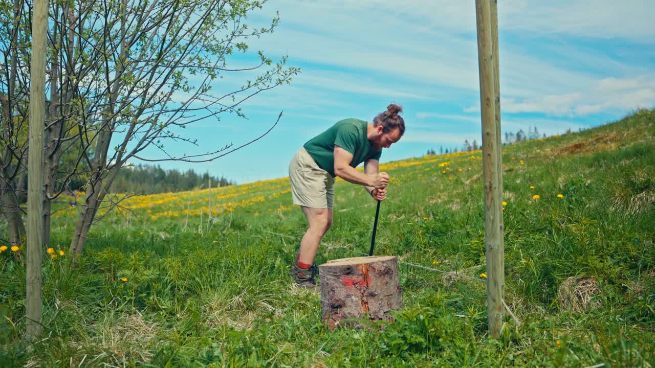 Man Building Fence In The Yard In Countryside Norway
