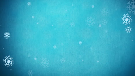 animación de un patrón navideño de copos de nieve sobre un fondo azul