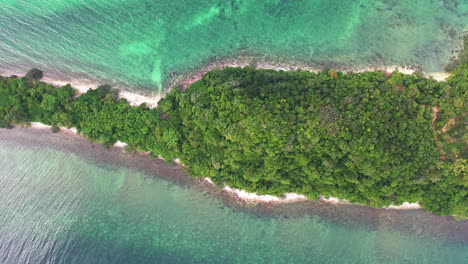 aerial view of a island surrounded by turquoise color