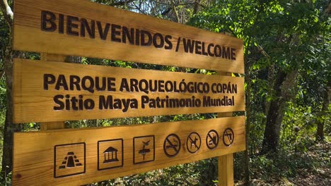 copan archaeological park, mayan world heritage site, sign board in forest, copan ruinas, honduras