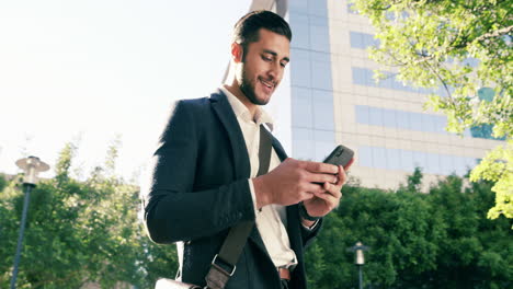 a-handsome-young-businessman-using-a-mobile-phone