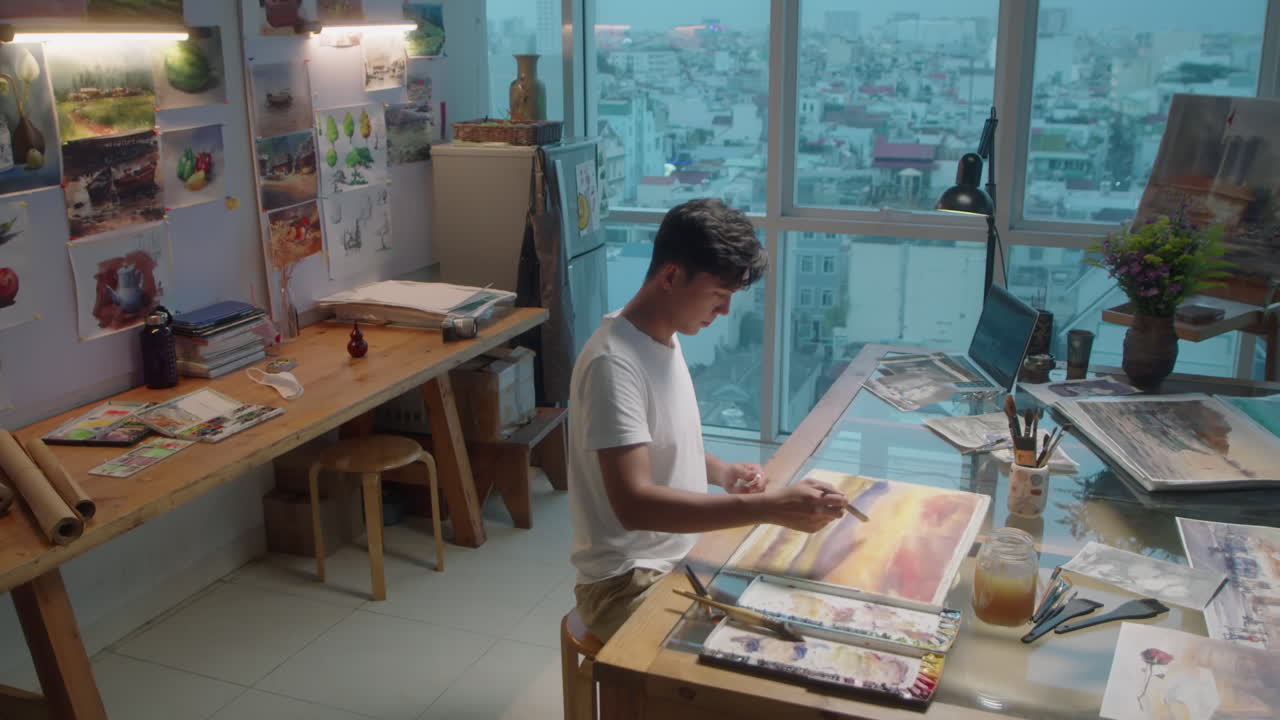 Artist Working on Abstract Painting in Studio