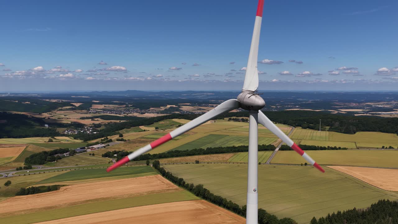 wind turbines overlooking the eifel region, hills, clean energy from the wind. Aerial video