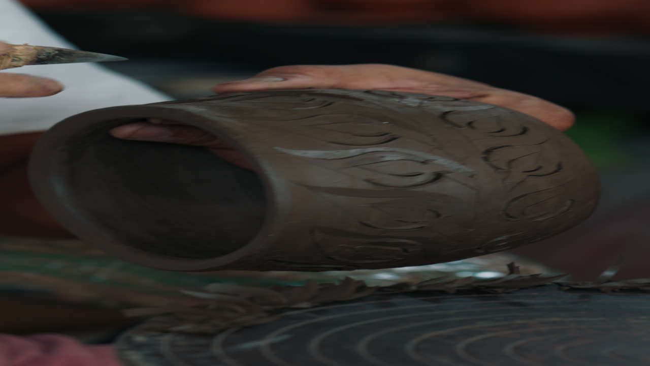 Artisan Creating a Hand-Carved Clay Bowl