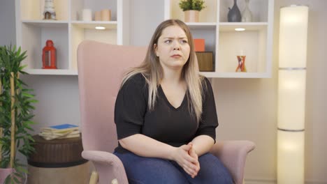 Paranoid-young-woman-looking-around-at-home.