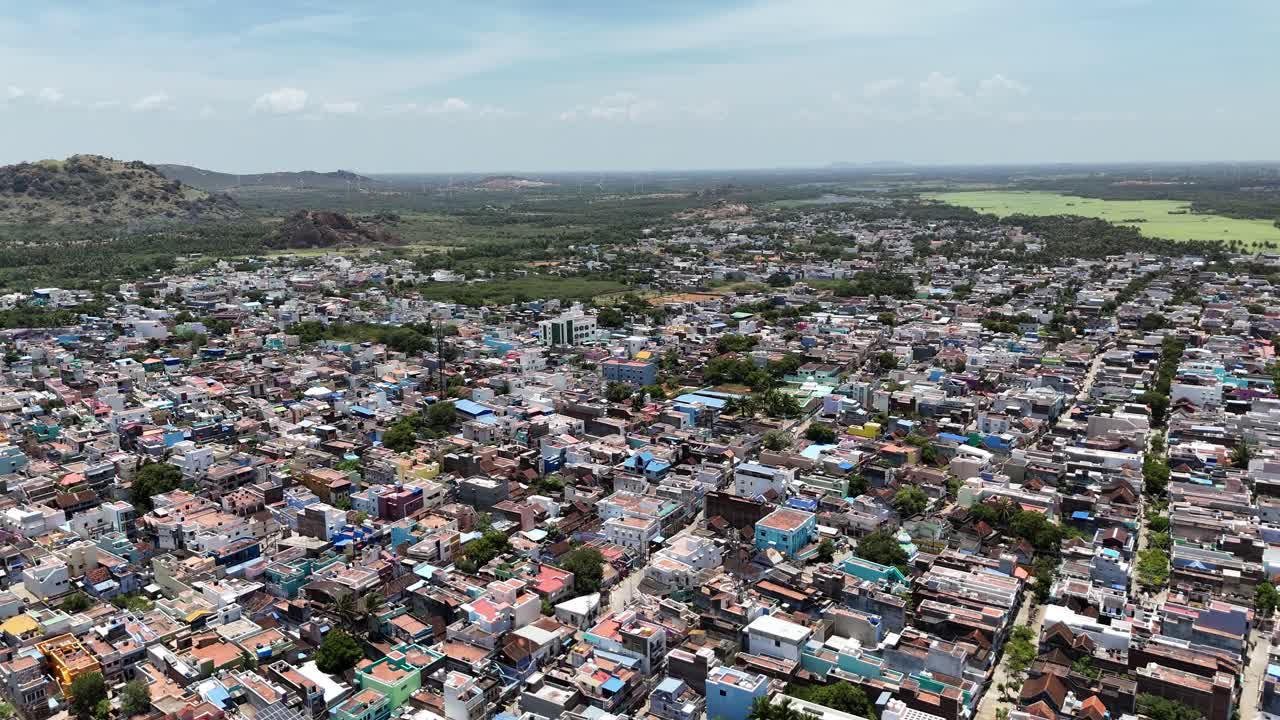 The aerial view of Indian hill station, blending community life with natural beauty. It illustrates the harmonious coexistence of a thriving community with the natural beauty of the Western Ghats
