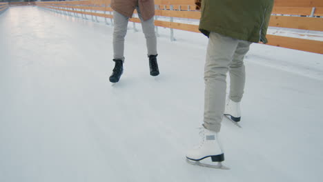 couple ice skating outdoors