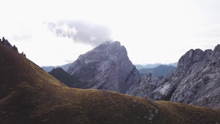 People hike in Alps - Drone flight Alps in Austria Vorarlberg