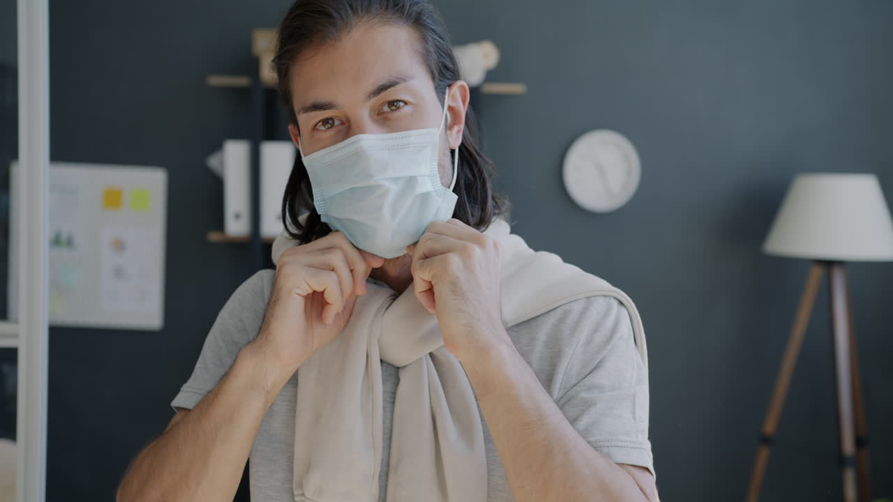 Man wearing a face mask in an office setting