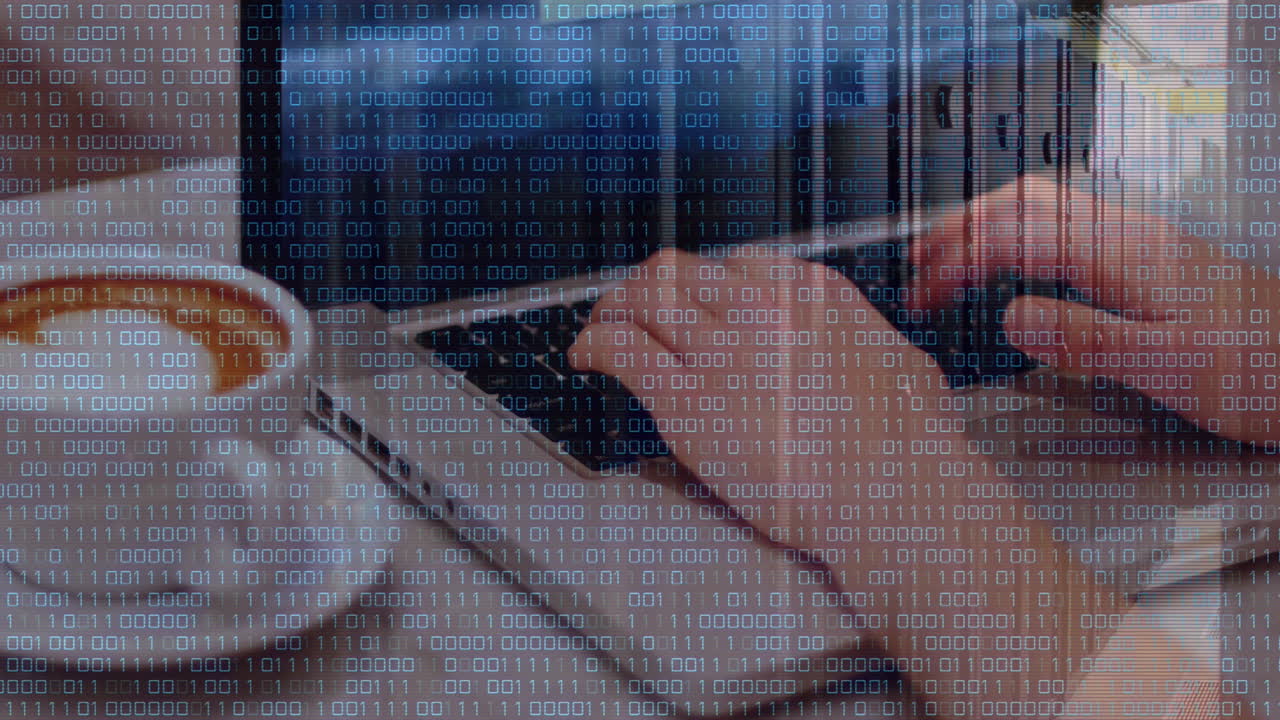 Animation of binary coding data processing over mid section of a woman using laptop at a cafe