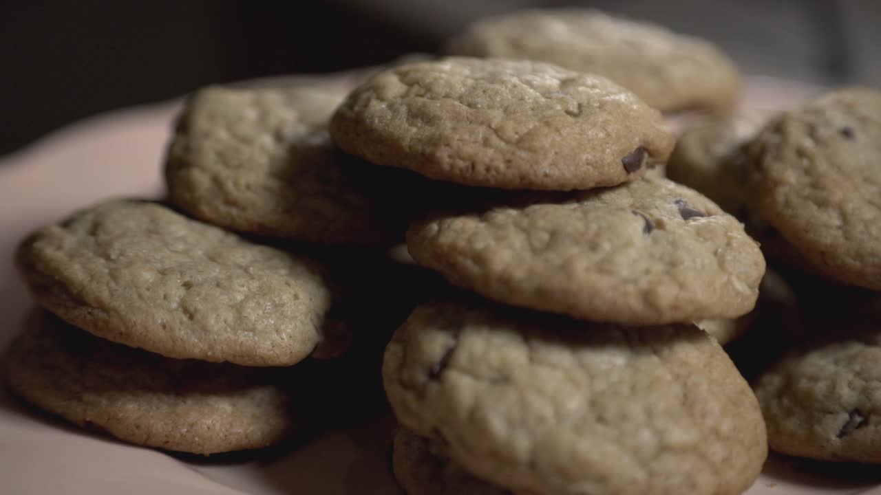 Tilt Up Of A Delicious Cookie In A Pink Plate - Close Up Shot