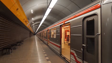 opened doors of empty metro train and idle metro subway station