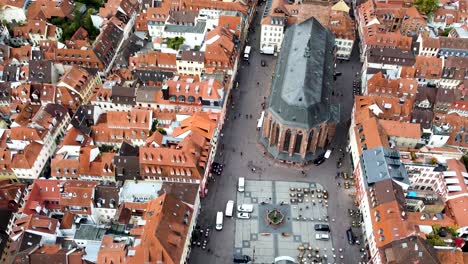 Church-of-the-Holy-Spirit-and-Heidelberg-Cityscape,-Germany,-Revealing-Aerial-View-of-Landmark-and-Old-Town-Buildings