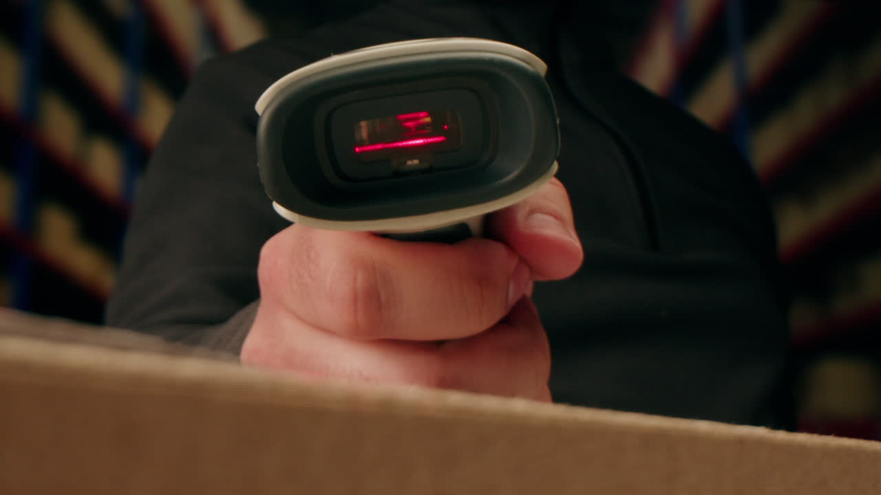 Scanner scan delivery box in storage, E-commerce shop, man packing goods and clothes second hand delivery market, courier Packaging and Shipping Workspace with Supplies and Technology, online sales.