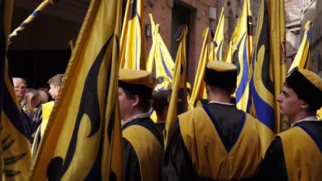 medieval or renaissance parade with yellow flags