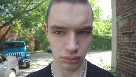 caucasian man moving head forward and backward in front of a camera