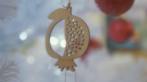 wooden pomegranate new year decoration against bokeh background