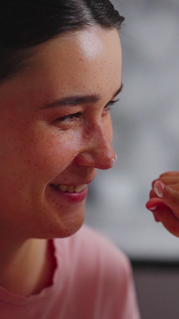 A Heartwarming Moment of Connection: A Smiling Woman is Gently Touched by a Child's Hand in a Beautiful Display of Love and Affection