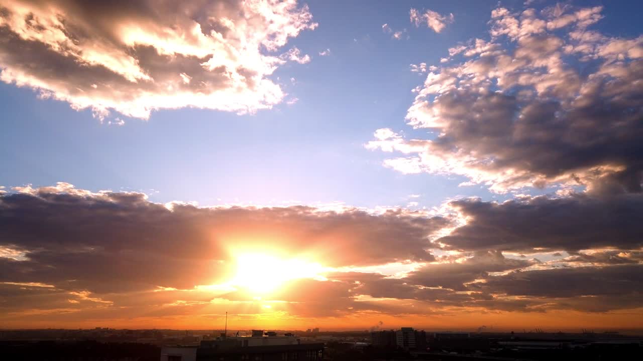 Stunning beautiful cloud timelapse of golden sunrise and purple sky at Sydney Airport