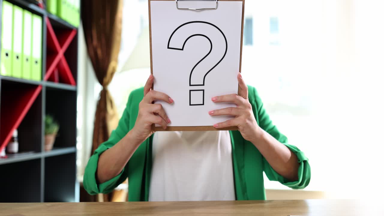 Woman holding a question mark on a clipboard