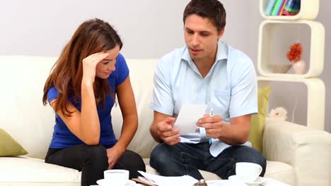 brunette man talking to desperate woman