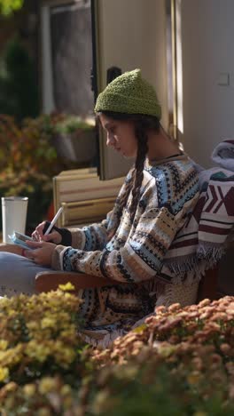 teenage girl drawing outdoors in a camper