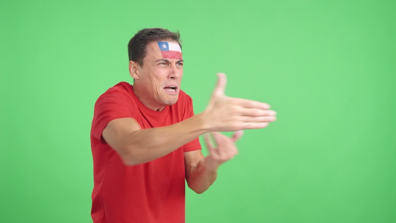 Man cheering for Chile, angry with the decision of referee