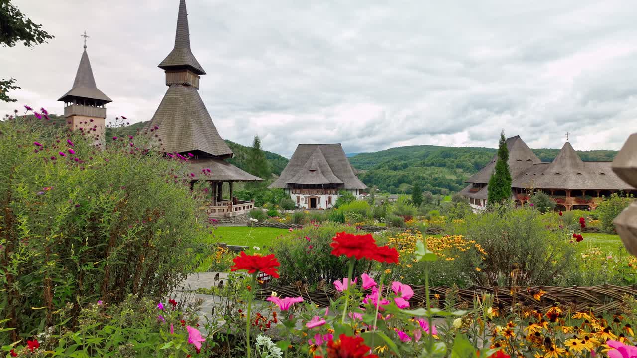 Beautiful flowers adorn Barsana monastery chapel gardens Maramures