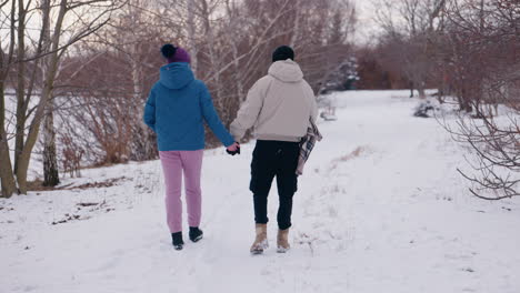 couple walking in the snow