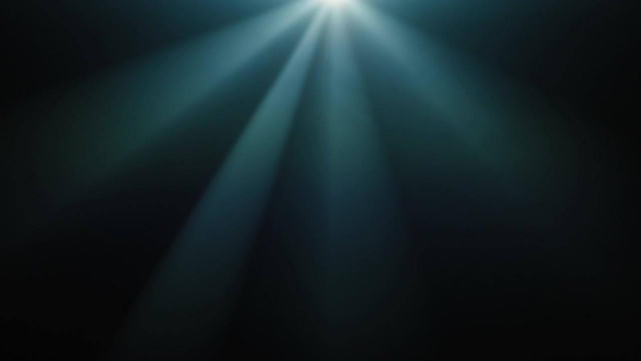 Blue Light Rays Shining Down on Dark Background
