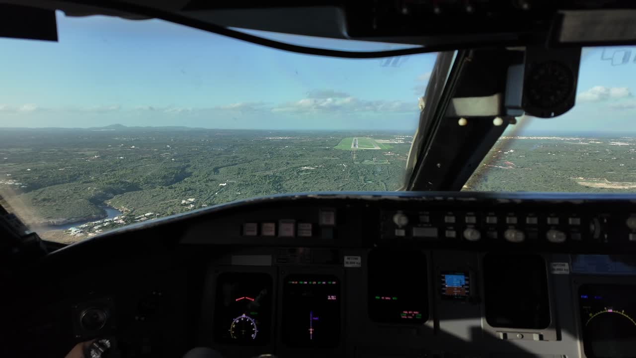 Pilot’s FPV. Real time approach to coastal Menorca airport (Spain) as seen by the flying pilot from cockpit. Immersive pilot’s perspective. Daylight. 4K 60FPS