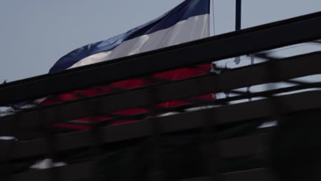 Costa-Rica-flag-gently-waving-in-slow-motion-in-the-wind,-with-vibrant-red-white-and-blue-colors-outdoors