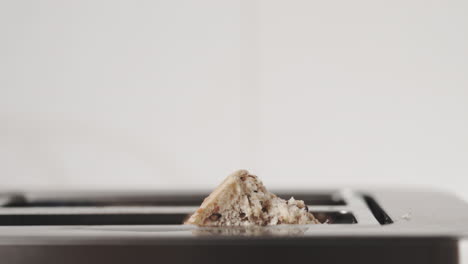 Sourdough-raw-bread-baking-in-toaster-macro