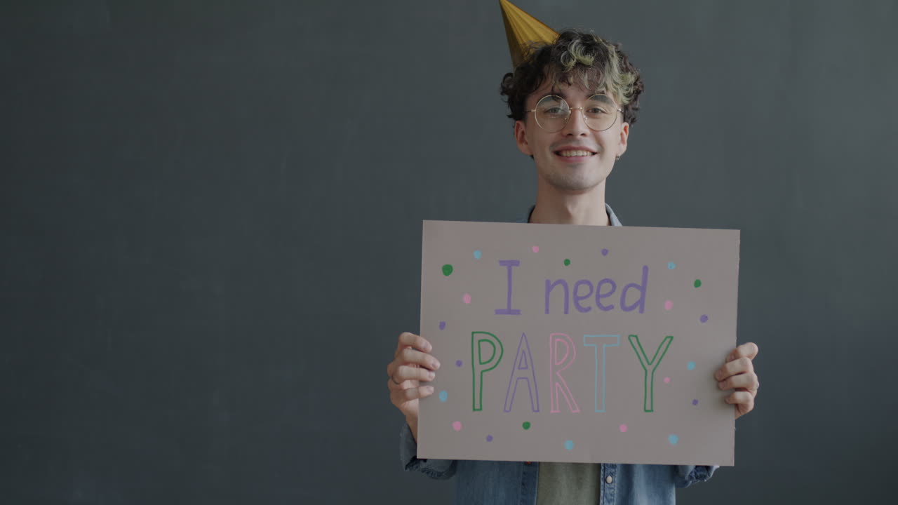 Man Holding a Party Sign