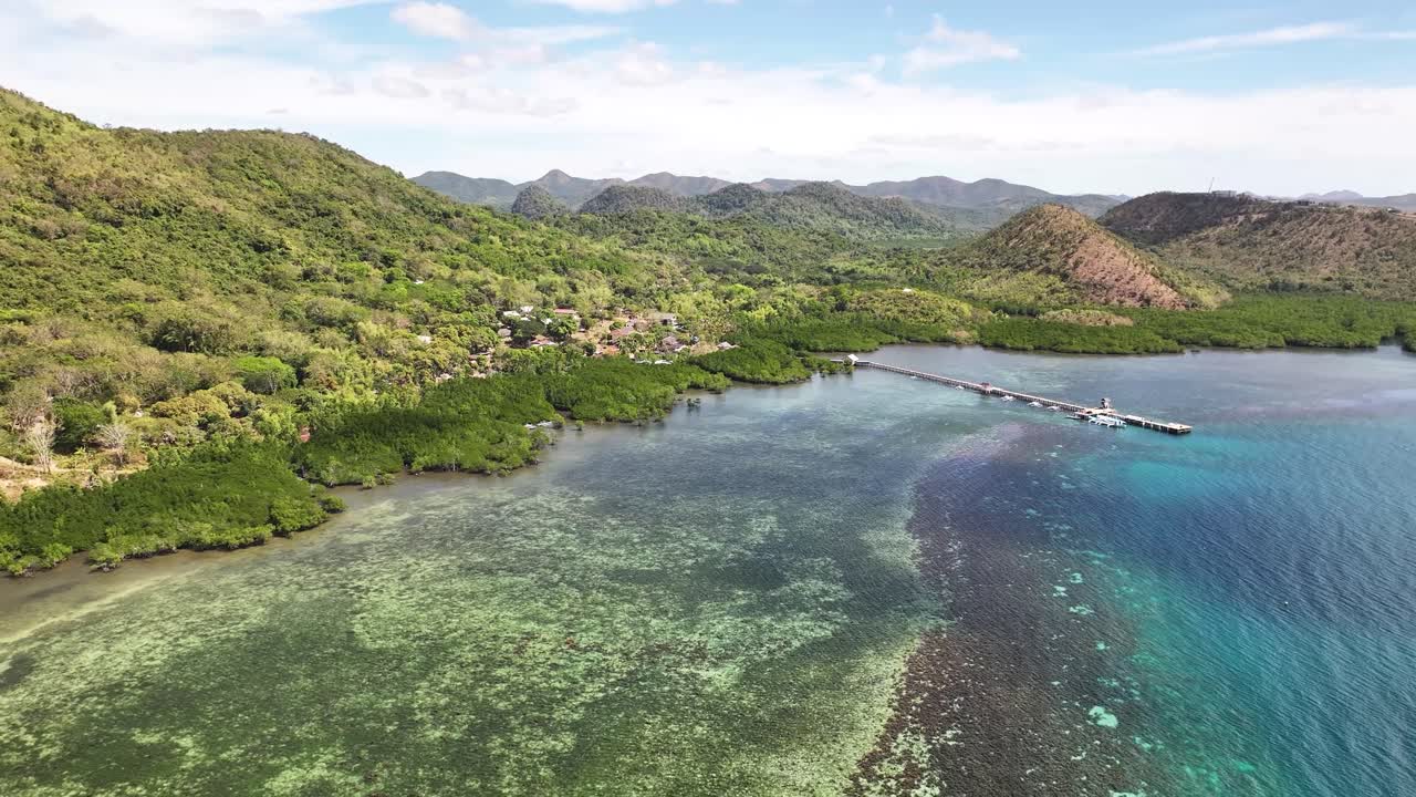 Pier On Blue Coastal Waters With Lush Green Hills And Forests In Busuanga, Palawan, Philippines, wide aerial shot