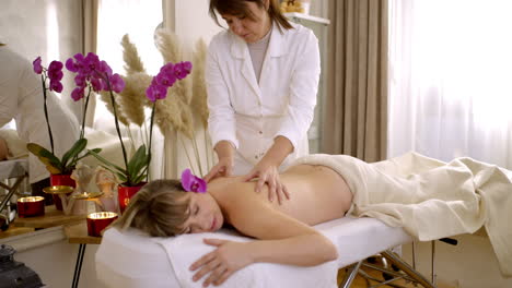 woman receiving a massage at a spa