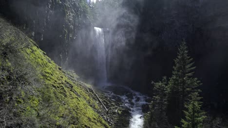 waterfall on sunny day with lots of mist