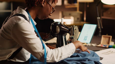 designer using sewing machine