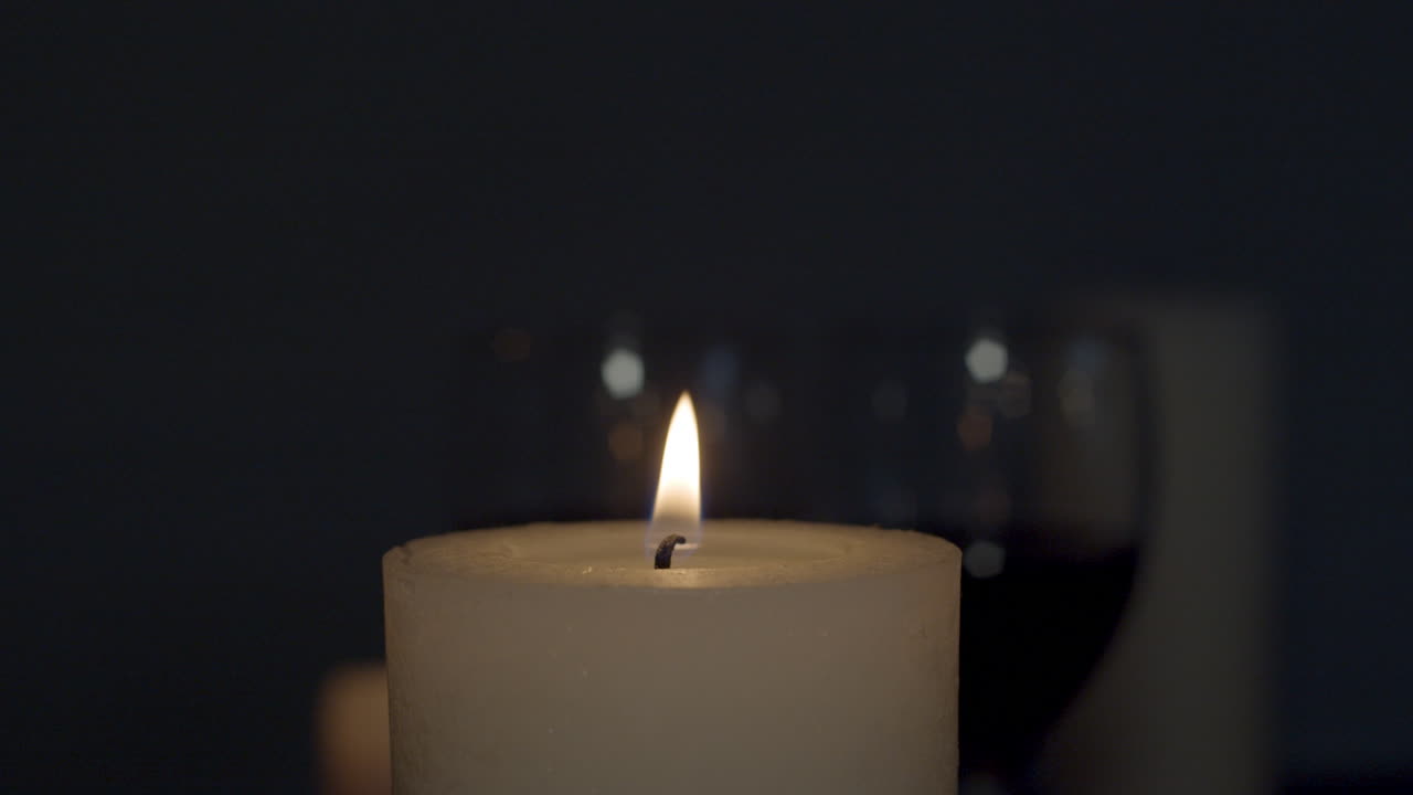 Candle being lit with lighter and being blown out later