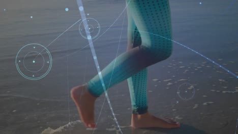 animation of networks of connections over caucasian woman walking on beach