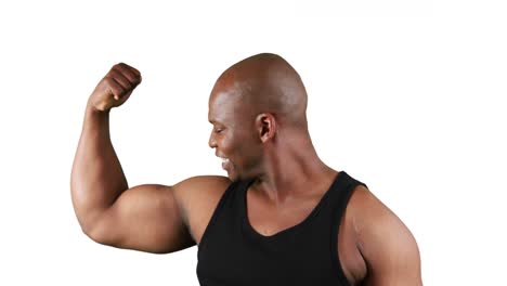 smiling muscular man with meat flexing muscles