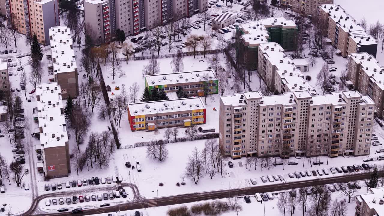 Kindergarten in the city of Kaunas under a blanket of snow. Aerial view