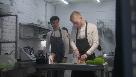 chef team preparing food in a restaurant kitchen