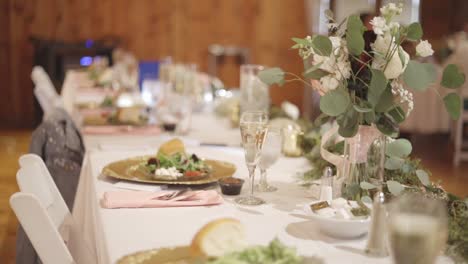 beautiful table settings at wedding reception with flowers