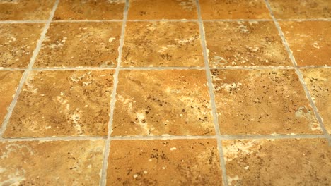 4k shot of square floor tiles installed on bathroom floor