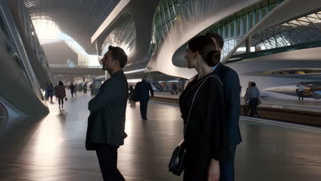 people in a modern futuristic transport hub